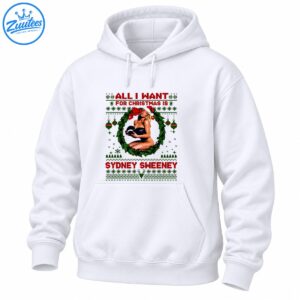 Christmas shirt design with Sydney Sweeney text, a blonde woman in a Santa hat, green holly wreath, red bow, and festive sweater patterns