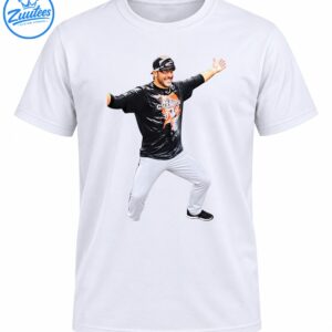 Smiling baseball player celebrating with arms outstretched in black Champions shirt and white pants