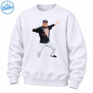 Smiling baseball player celebrating with arms outstretched in black Champions shirt and white pants