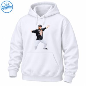Smiling baseball player celebrating with arms outstretched in black Champions shirt and white pants