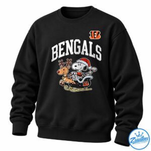 Bengals Snoopy Christmas football shirt design with Snoopy in a Santa suit riding a sleigh with a reindeer beneath bold BENGALS lettering.