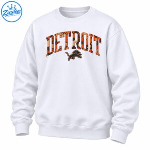Detroit fall camo shirt design with orange tan and black arched DETROIT lettering and a leaping lion graphic