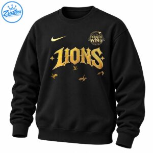 Black shirt graphic with distressed gold LIONS lettering, a Fourth Wing circular emblem, a gold swoosh, and dragon-like silhouettes