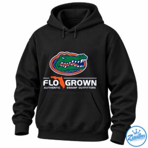 Green snarling alligator graphic with orange and blue oval, Florida silhouette, and FLOGROWN SWAMP OUTFITTERS text