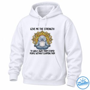 Gray-blue meditating manatee with closed eyes and a colorful yellow, orange, red, and green mandala design.