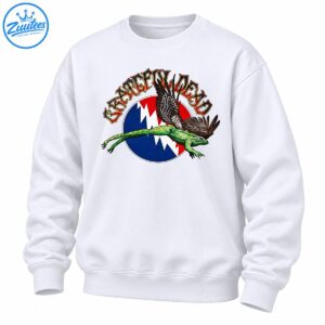 Grateful Dead lettering above a green flying frog with feathered wings and a red blue and white lightning bolt emblem