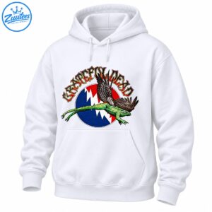 Grateful Dead lettering above a green flying frog with feathered wings and a red blue and white lightning bolt emblem