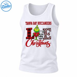 Green Grinch holding a red heart with Tampa Bay Buccaneers text, plaid LOVE letters, leopard spots, and red Christmas script