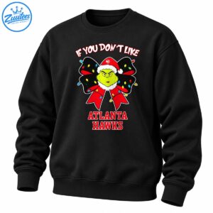 Grumpy green Christmas character in a Santa hat with a red bow, colorful lights, and Atlanta Hawks lettering