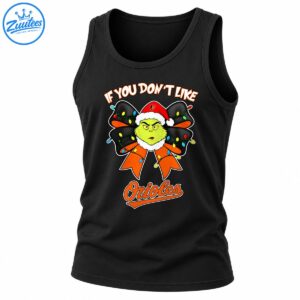 Grumpy green character in a Santa hat with a black and orange bow, colorful Christmas lights, and Orioles lettering