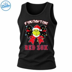 Grumpy green holiday character in a Santa hat with a red bow, colorful Christmas lights, and Red Sox lettering