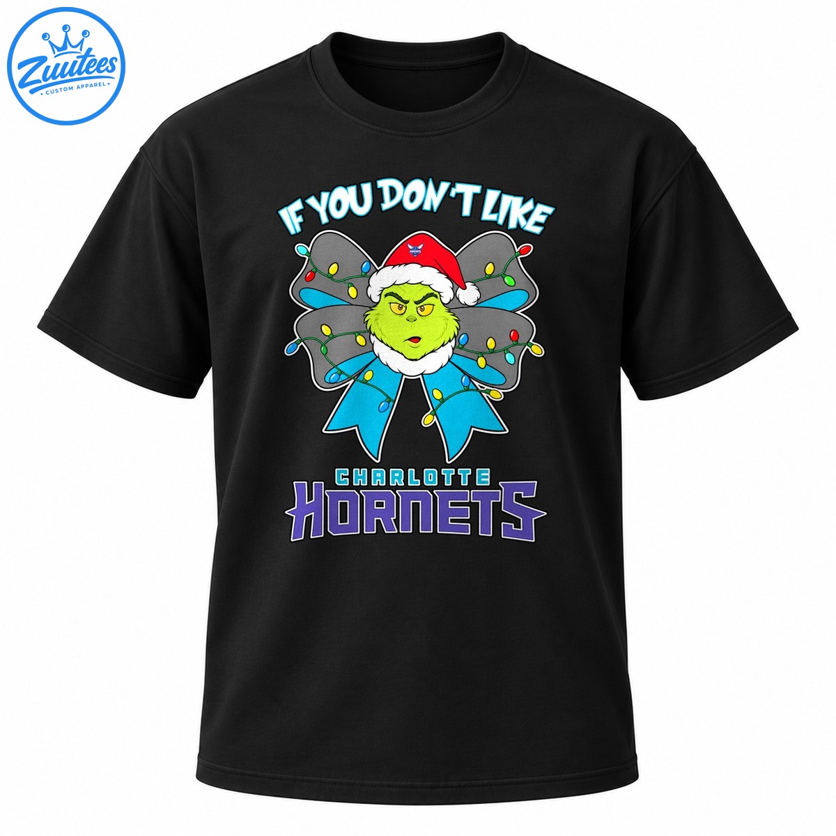 Grumpy green Christmas character in a Santa hat with a colorful light wrapped blue bow and Charlotte Hornets lettering Grumpy green Christmas character in a Santa hat with a colorful light-wrapped blue bow and Charlotte Hornets lettering