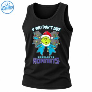 Grumpy green Christmas character in a Santa hat with a colorful light-wrapped blue bow and Charlotte Hornets lettering