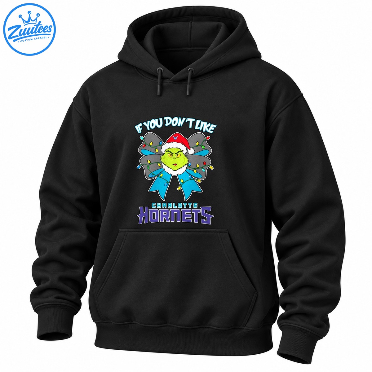 Grumpy green Christmas character in a Santa hat with a colorful light wrapped blue bow and Charlotte Hornets lettering Grumpy green Christmas character in a Santa hat with a colorful light-wrapped blue bow and Charlotte Hornets lettering