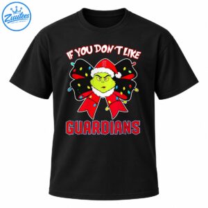 Grumpy green Grinch character in a red Santa hat inside a black Christmas bow with colorful lights and bold Guardians lettering