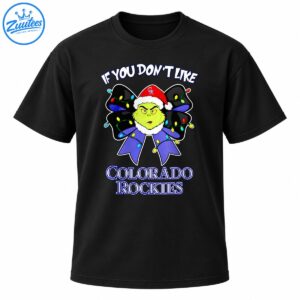 Grumpy green Christmas character in a Santa hat with a purple bow, colorful lights, and Colorado Rockies lettering