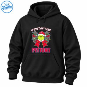 Green grumpy Christmas character in a Santa hat with a festive lighted bow and bold red and blue PISTONS lettering
