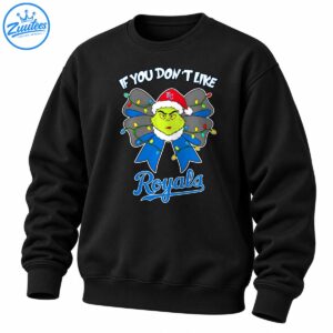 Green Grinch in a red Santa hat with a blue and gray Christmas bow, colorful lights, and Royals lettering