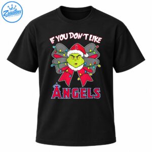 Grumpy green Christmas character in a Santa hat with a red and gray bow, colorful lights, and Angels lettering.