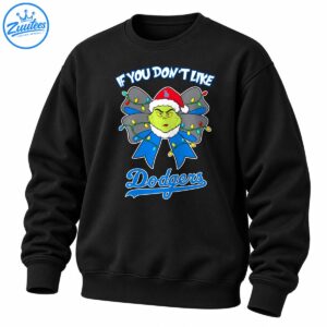 Green grumpy character in a Santa hat with a blue Christmas bow, colorful lights, and Dodgers lettering.