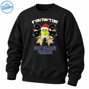 Grumpy green Christmas character in a Santa hat on a festive bow with colorful lights and New Orleans Pelicans text
