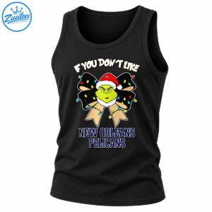 Grumpy green Christmas character in a Santa hat on a festive bow with colorful lights and New Orleans Pelicans text