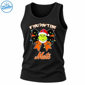 Grumpy green Grinch in a red Santa hat with a Mets emblem, black and orange Christmas bow, colorful lights, and orange Mets lettering