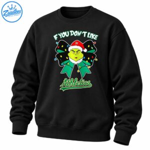 Grumpy green character in a red Santa hat on a Christmas light-covered bow with Athletics lettering