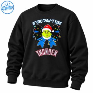 Grumpy green holiday character in a Santa hat on a black bow with colorful lights and bold Thunder lettering