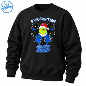Grinch-inspired face in a Santa hat with a blue and black Christmas bow, colorful lights, and Orlando Magic lettering