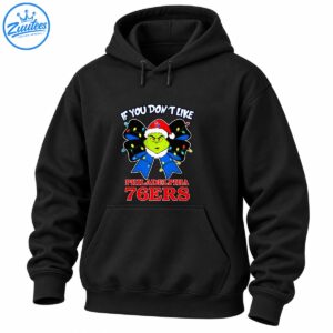 Grinch wearing a red Santa hat with a blue Christmas bow, colorful lights, and Philadelphia 76ers lettering