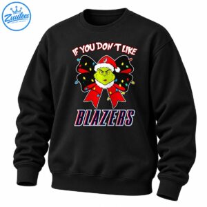 Green holiday character in a Santa hat on a red and black Christmas bow with colorful lights and bold BLAZERS lettering