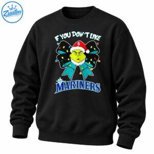 Green grumpy Christmas character in a Santa hat with a teal bow, colorful lights, and bold Mariners lettering