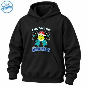 Green grumpy Christmas character in a Santa hat with a teal bow, colorful lights, and bold Mariners lettering