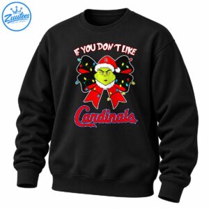 Grumpy green Christmas character in a Santa hat with a red bow, colorful lights, and bold holiday baseball lettering.