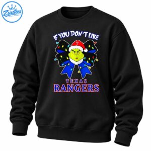 Grinch-inspired green character in a Santa hat with a Christmas light bow and Texas Rangers lettering