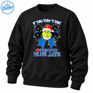 Grumpy green character in a Santa hat on a blue bow with Christmas lights and Toronto Blue Jays lettering