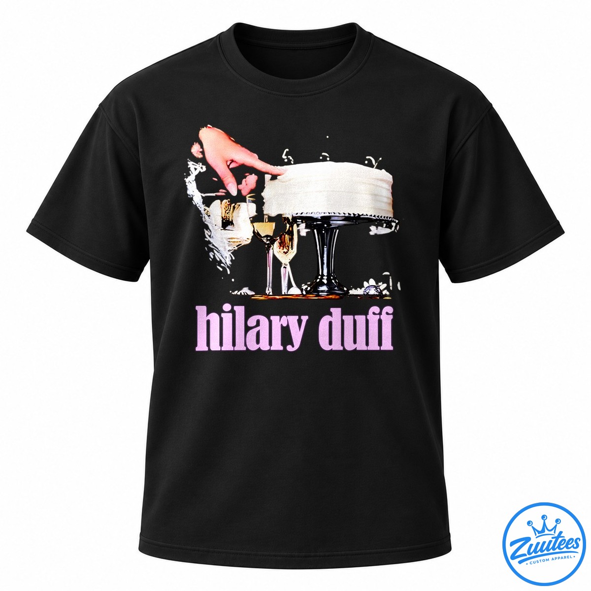 Hilary Duff Birthday Cake Celebration Celebrity Shirt Hilary Duff graphic with a white frosted birthday cake, champagne glasses, a reaching hand, and bold pink lettering.