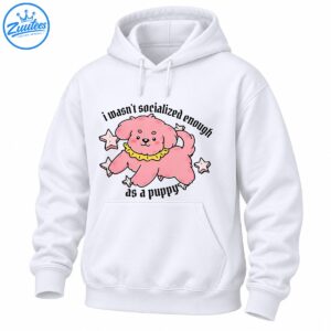 Pink fluffy cartoon puppy with a yellow ruffled collar, star accents, and black text reading I wasn't socialized enough as a puppy.