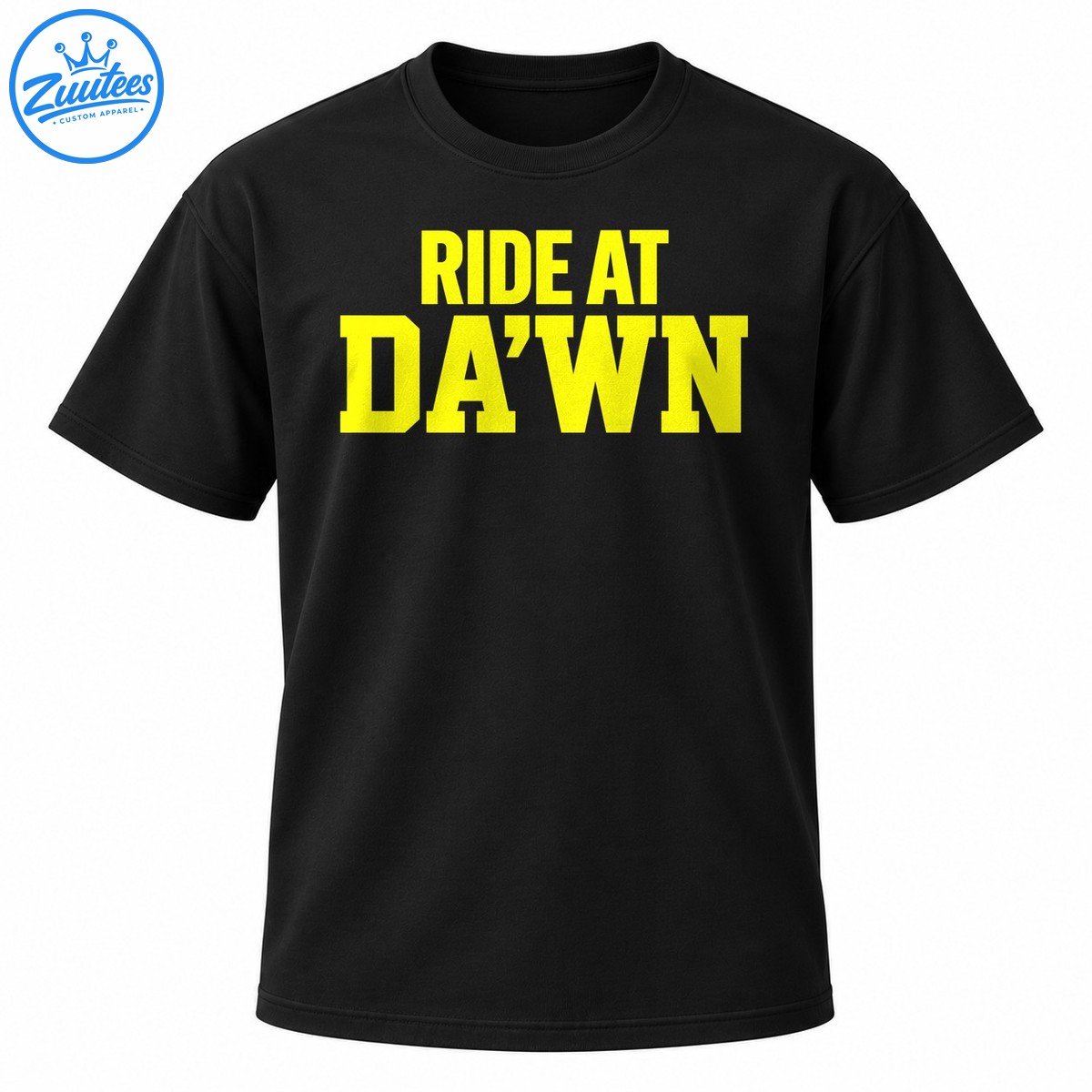 Bright yellow RIDE AT DA’WN collegiate lettering in two lines on a dark background Bright yellow RIDE AT DA’WN collegiate lettering in two lines on a dark background