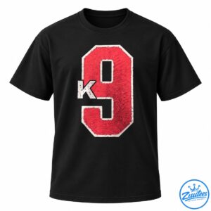 Distressed red number 9 graphic with a cream outline and overlapping cream letter K on a black background.