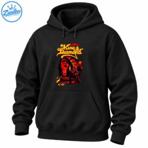 King Diamond gothic metal artwork with yellow lettering, a screaming face, candle, cloaked figures, castle, and fiery red-orange scenery