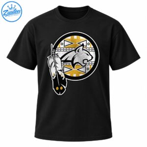 Circular silver-gray cougar emblem with distressed gold and white geometric patterns and decorative feathers on a black shirt.