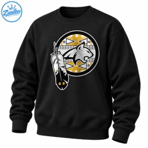 Circular silver-gray cougar emblem with distressed gold and white geometric patterns and decorative feathers on a black shirt.
