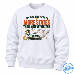 Funny dog travel shirt design with a sunglasses-wearing dog, travel van, US map, paw print markers, and bold orange and green text.
