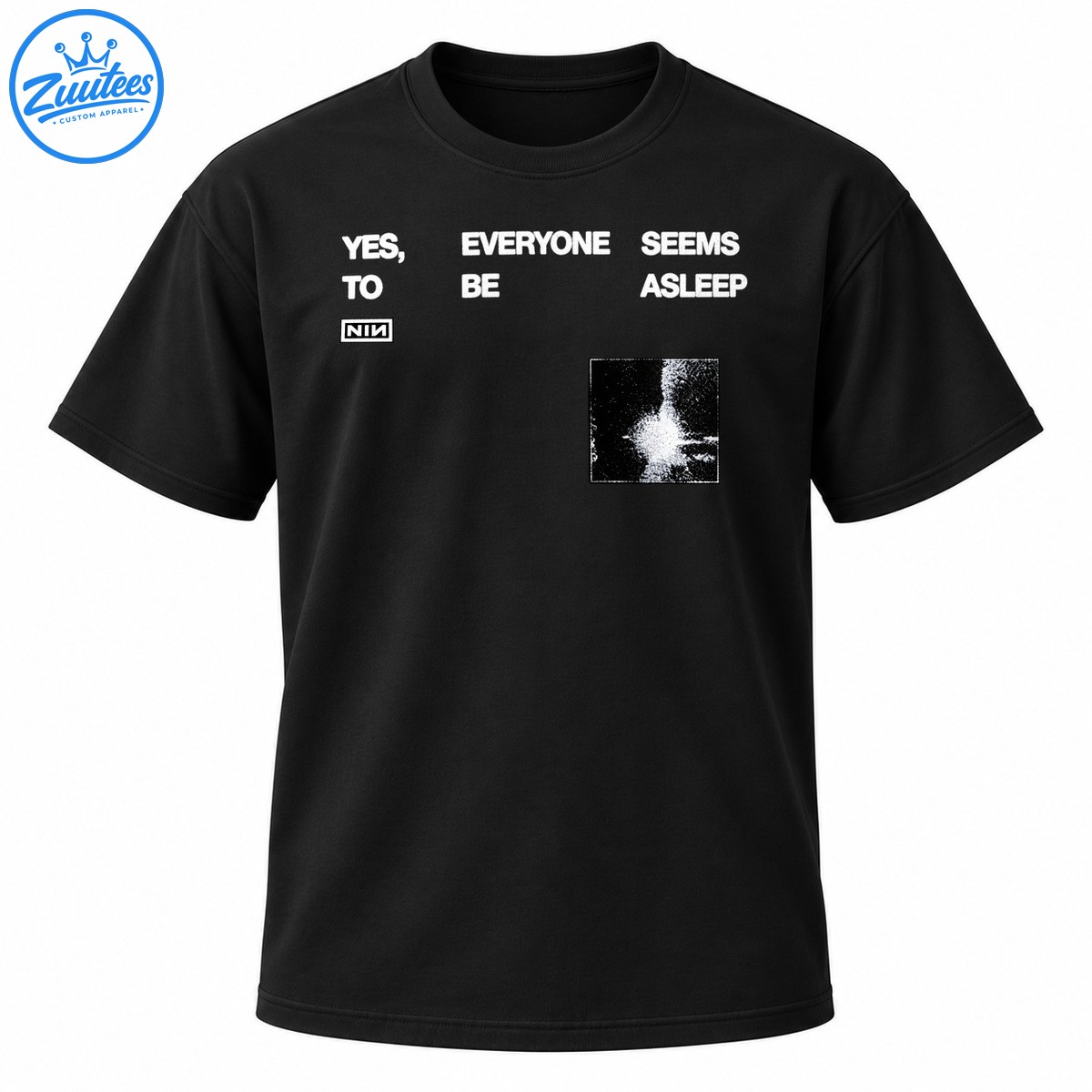 Black graphic shirt design with distressed white YES EVERYONE SEEMS ASLEEP lettering, boxed NIN logo, and grainy monochrome artwork. Black graphic shirt design with distressed white YES EVERYONE SEEMS ASLEEP lettering, boxed NIN logo, and grainy monochrome artwork.