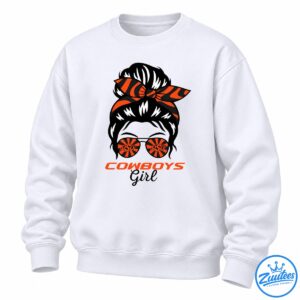 Cowboys Girl Shirt graphic with a black messy bun, orange and black bandana bow, sunburst sunglasses, and bold lettering.