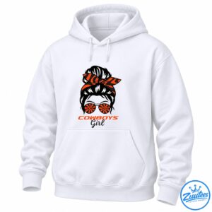 Cowboys Girl Shirt graphic with a black messy bun, orange and black bandana bow, sunburst sunglasses, and bold lettering.