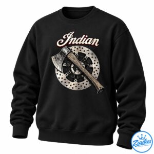 Vintage axe graphic with a wood-grain handle crossing a distressed metal disc beneath cream Indian script lettering.