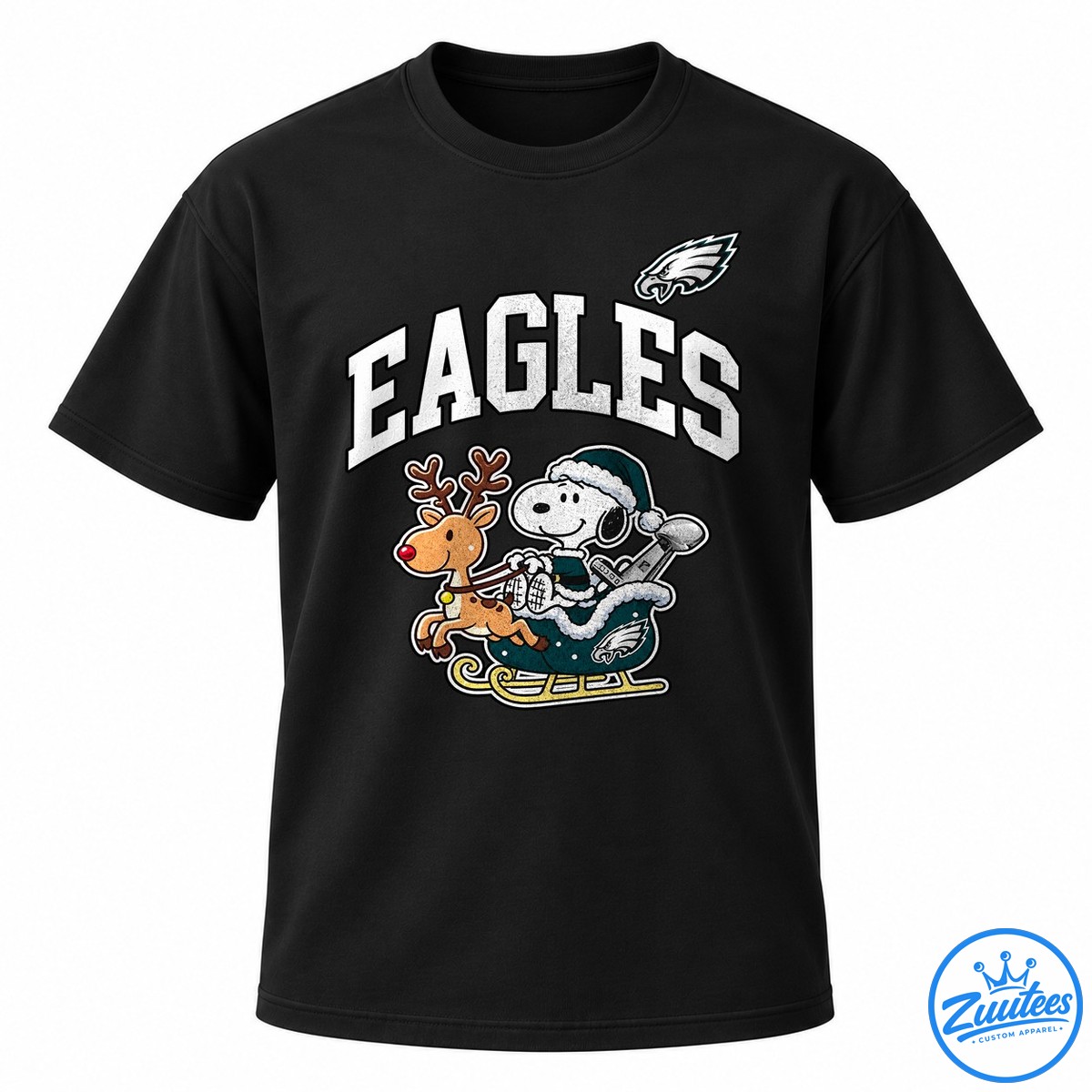 Philadelphia Eagles X Peanuts Snoopy Super Bowl Fly Eagles Fly Cartoon Shirt Snoopy in a teal winter outfit rides a sleigh with a red-nosed reindeer beneath bold white EAGLES lettering and an eagle emblem.